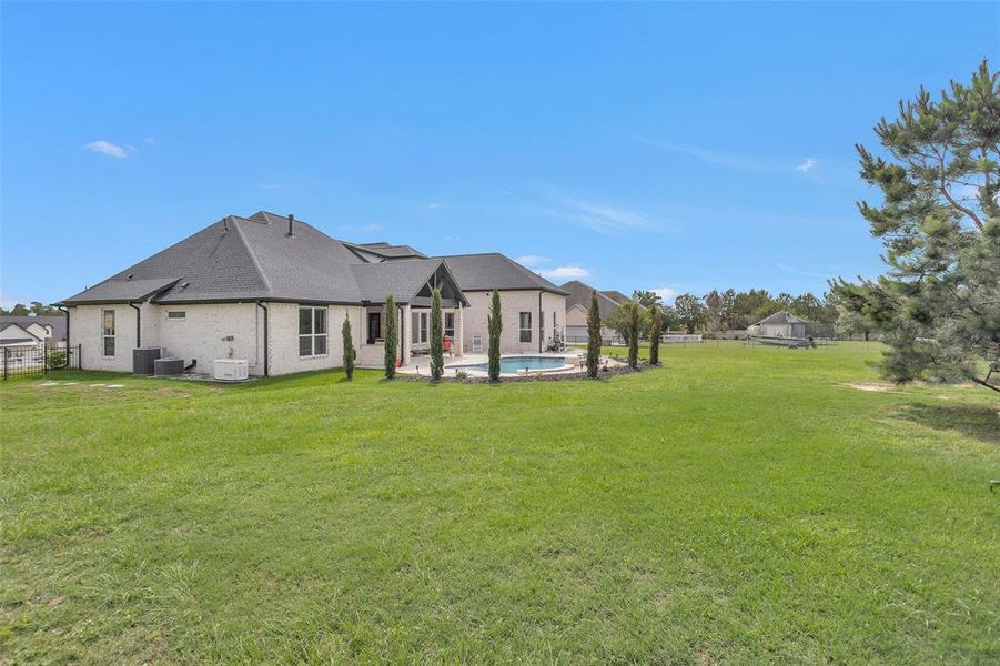 Back yard is fully fenced, keeping safety in mind; plus, it is a great space for pets. Newer 24 KW generator is also present at this home.