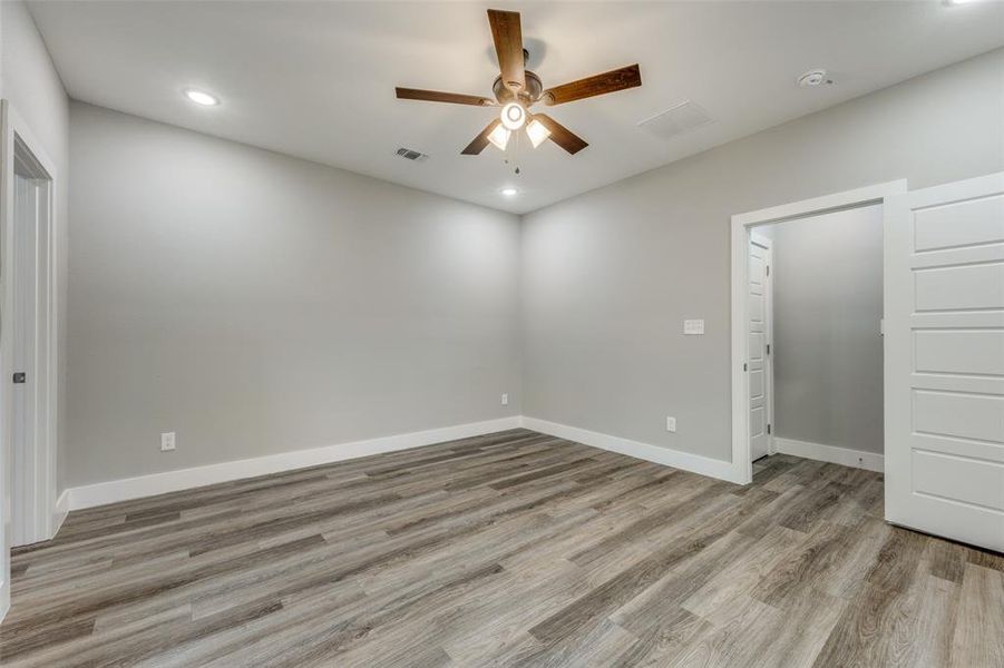 Unfurnished bedroom with recessed lighting, light wood-type flooring, and a ceiling fan
