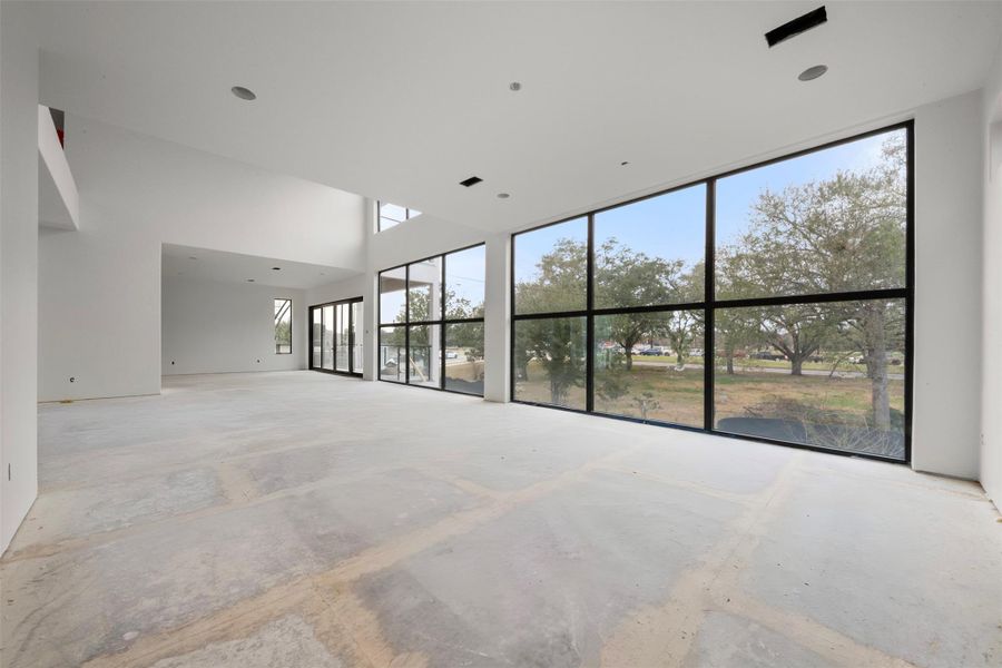 A perspective of the home from the living room showcasing the incredible natural light that flows through the home.