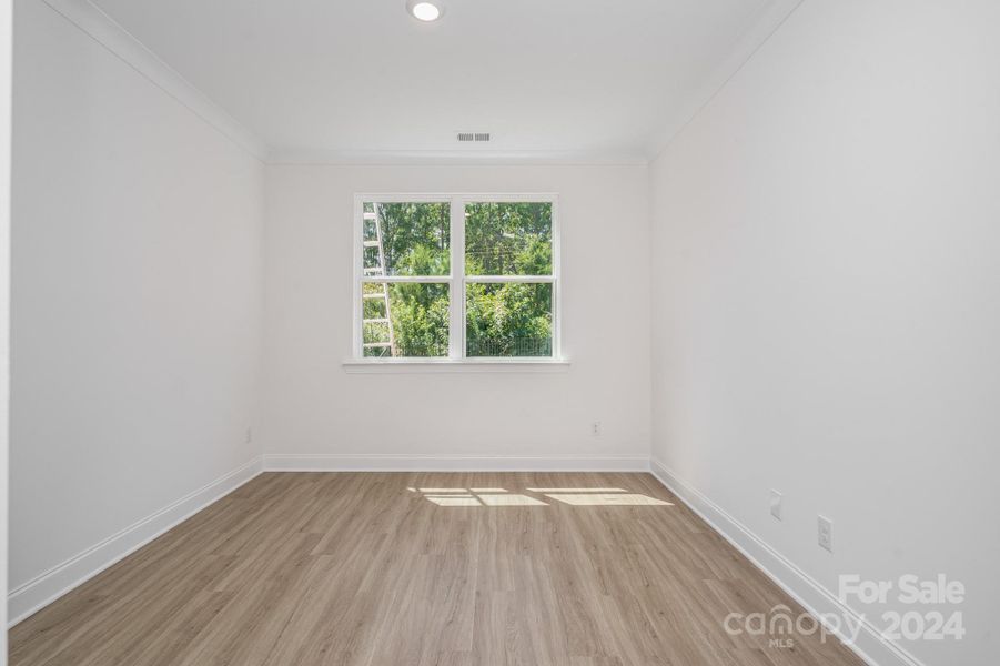 Representative Photo. Downstairs bedroom