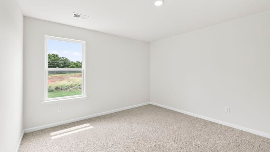 Spacious, unfurnished interior of a new home in Durbin Meadows Traditions, Fountain Inn (Image 29).