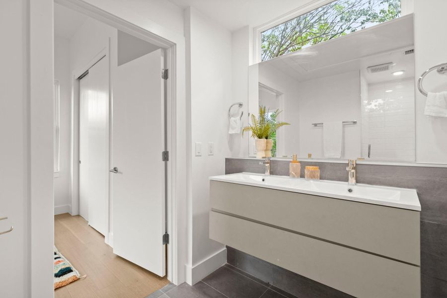 Dual sink vanity with modern fixtures and integrated storage