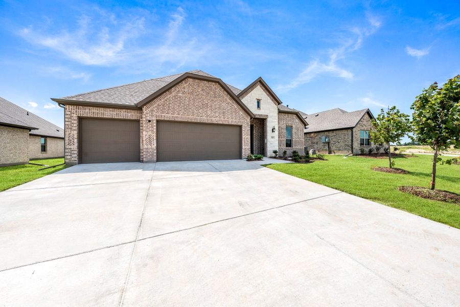 Front exterior of a new home in Forest Ridge Estates, Greenville, TX, highlighting curb appeal (Image 25). Front exterior of a new home in Forest Ridge Estates, Greenville, TX, highlighting curb appeal (Image 25).