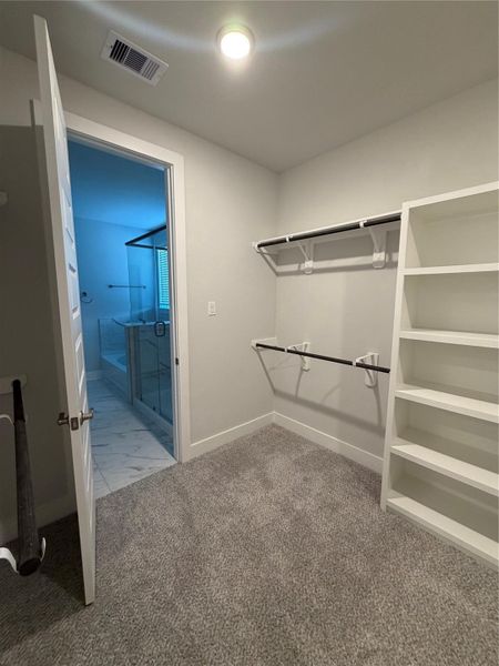 Primary walk-in closet Primary walk-in closet