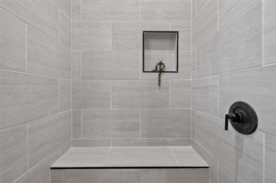 Primary Shower has window, niche, and bench Primary Shower has window, niche, and bench