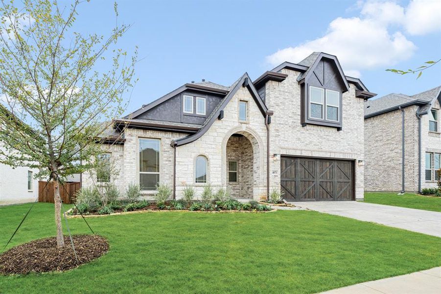 Front exterior of a new home in Windsong Ranch Classic 61, Prosper, TX, highlighting curb appeal (Image 2).