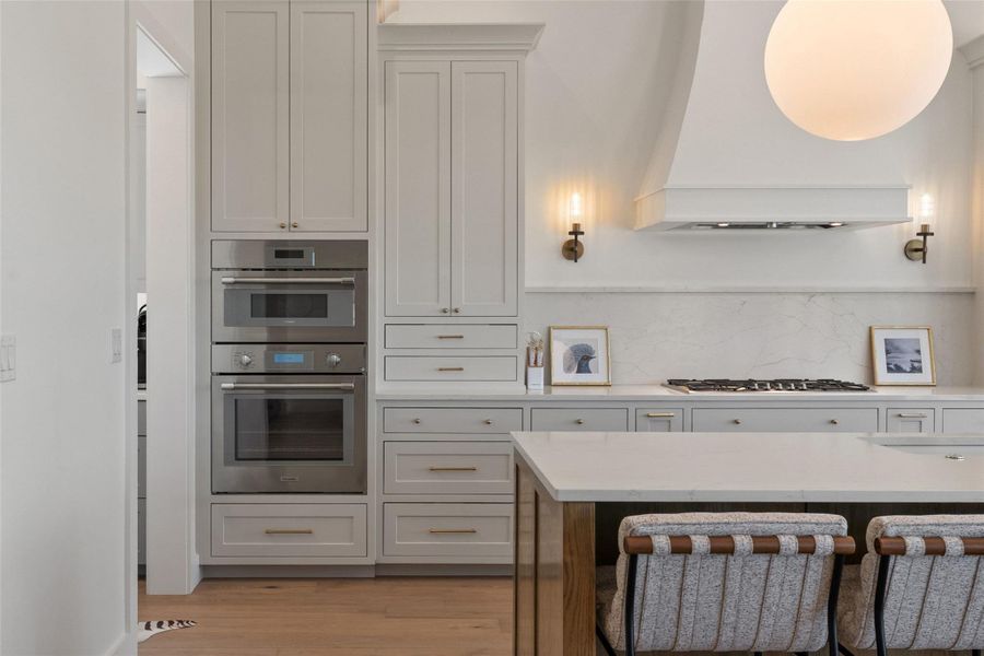 Culinary excellence awaits in this well-appointed kitchen, featuring sleek appliances and a spacious island. Culinary excellence awaits in this well-appointed kitchen, featuring sleek appliances and a spacious island.