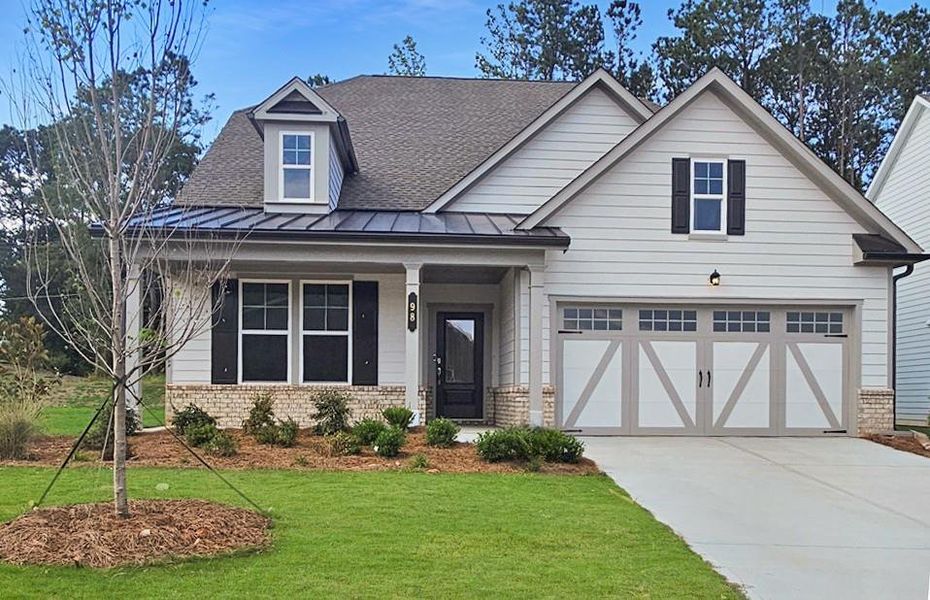 Front exterior of a new home in Twelve Parks 55+, Sharpsburg, GA, highlighting curb appeal (Image 1).