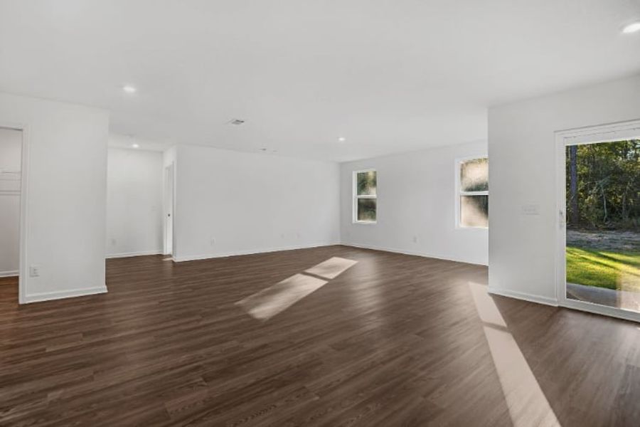 A room with a wood floor and white walls. A room with a wood floor and white walls.