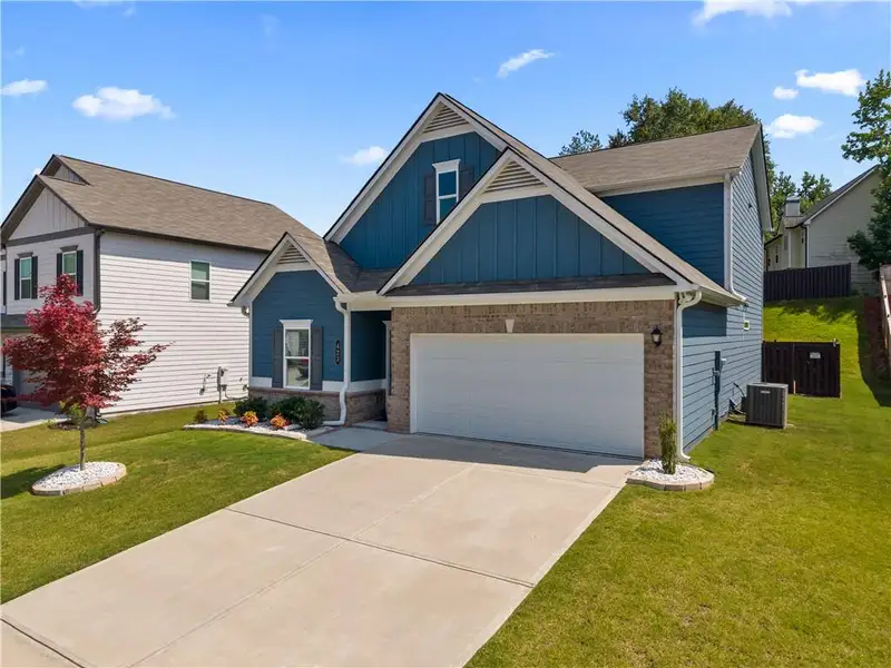 Front exterior of a new home in , Temple, GA, highlighting curb appeal (Image 2). Front exterior of a new home in , Temple, GA, highlighting curb appeal (Image 2).