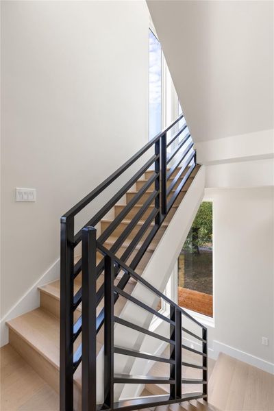 Clean lines and warm wood steps define this modern multi-level staircase.