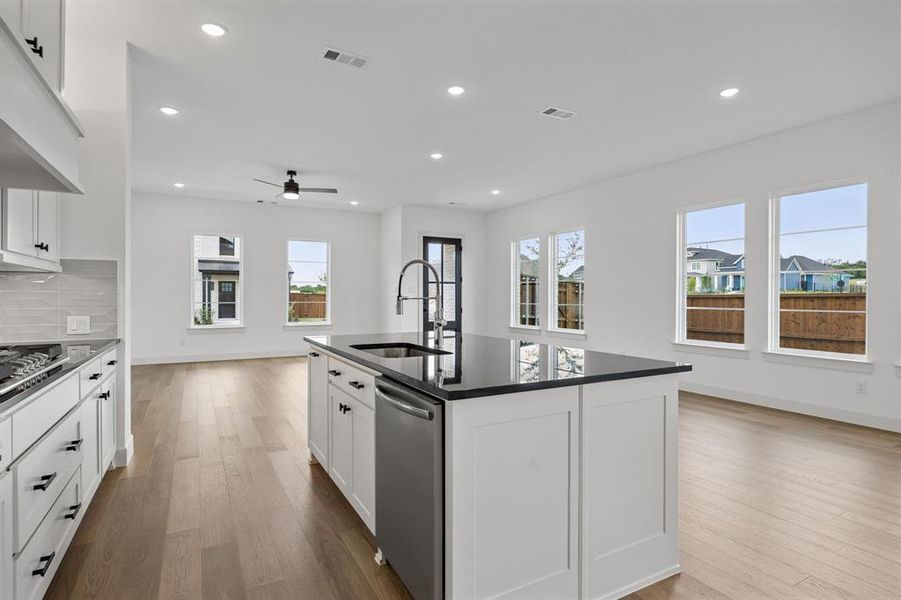 The chef in the family will never be left out of the party in this wonderful open concept floor plan!