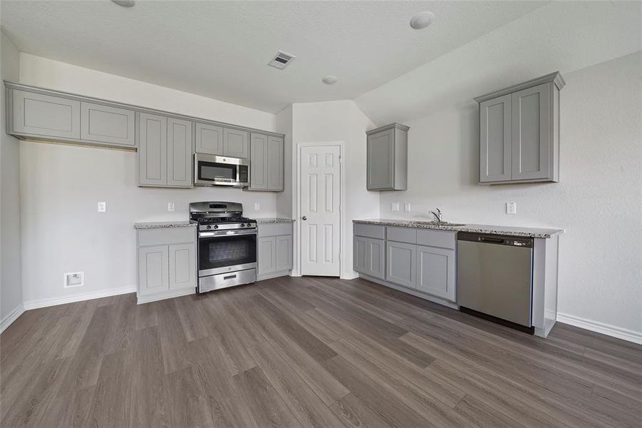 Spacious kitchen with stainless appliances