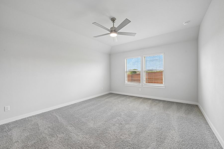 Primary Bedroom in the Heisman home plan by Trophy Signature Homes Primary Bedroom in the Heisman home plan by Trophy Signature Homes