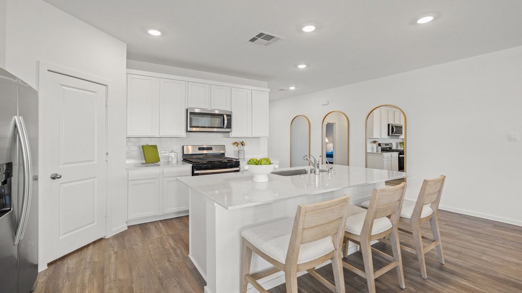 Representative furnished interior of a home built from the Rosemont by D.R. Horton in Sunterra Lakes, Brookshire (Image 13).