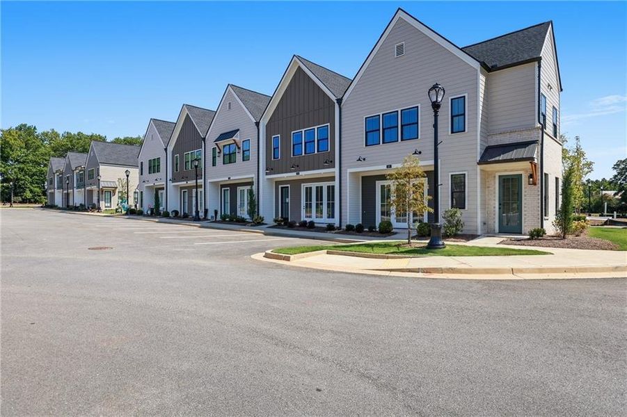 Front exterior of a new home in , Braselton, GA, highlighting curb appeal (Image 33).