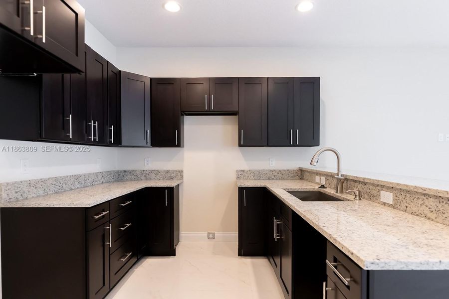 Furnished interior view inside a new home in , Tamarac (Image 17).
