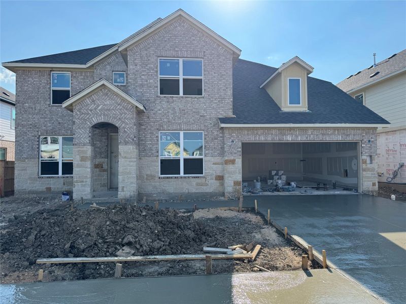 Front exterior of a new home in Barksdale, Leander, TX, highlighting curb appeal (Image 2). Front exterior of a new home in Barksdale, Leander, TX, highlighting curb appeal (Image 2).