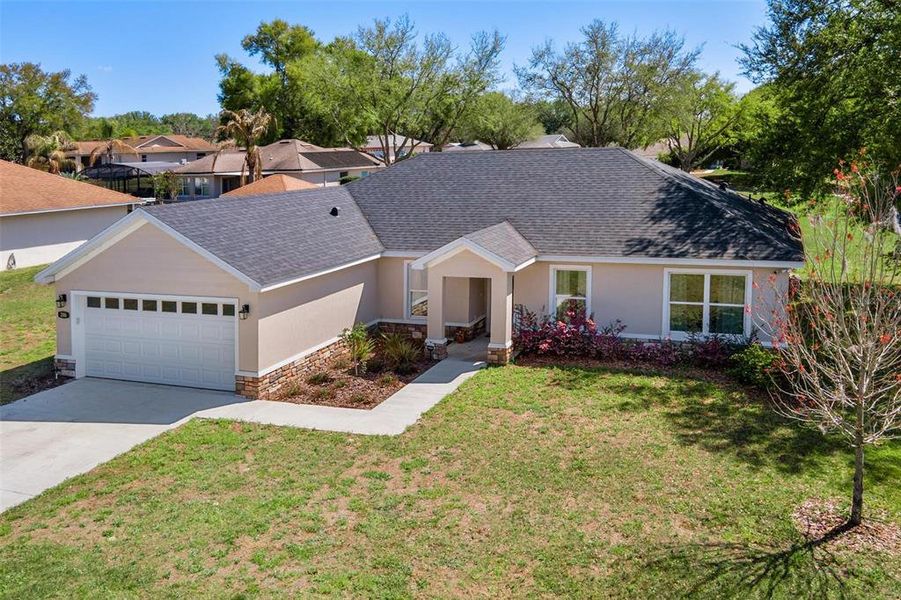 Front exterior of a new home in , Lady Lake, FL, highlighting curb appeal (Image 22).
