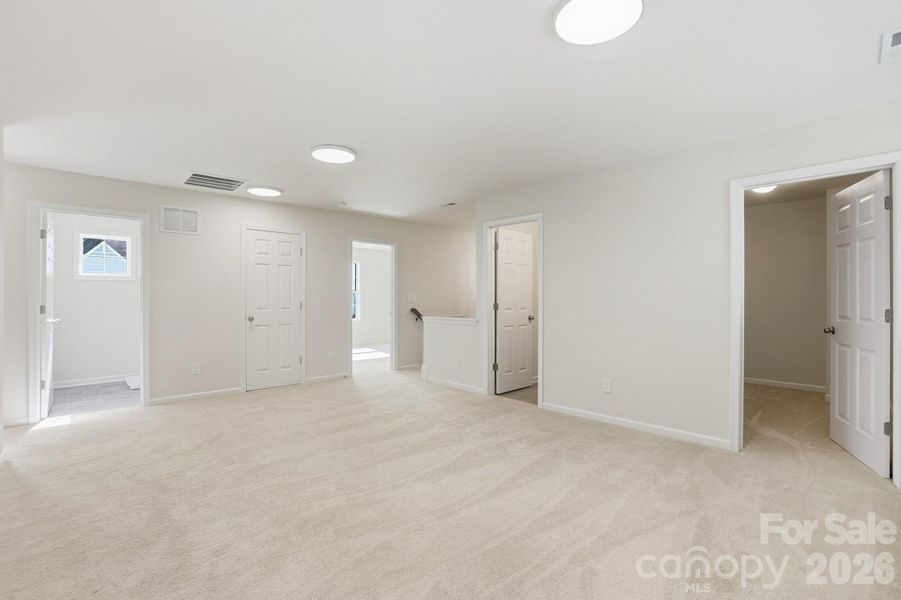 Upstairs, you’ll find three additional bedrooms, two full baths, and a versatile loft area—perfect for a home office, reading nook, or play space