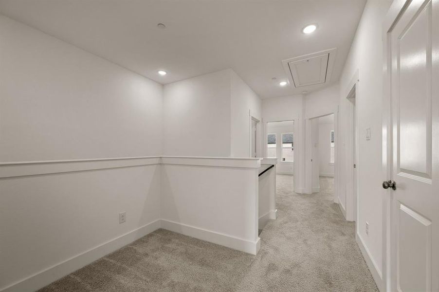 The loft at the top of the stairs makes a perfect pocket office or reading nook.