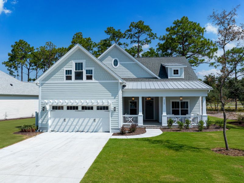 Front exterior of a new home in Osprey Landing, Southport, NC, highlighting curb appeal (Image 1).
