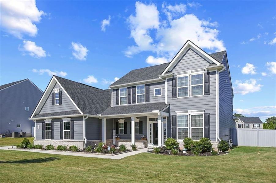 Front exterior of a new home in , Locust Grove, GA, highlighting curb appeal (Image 20).