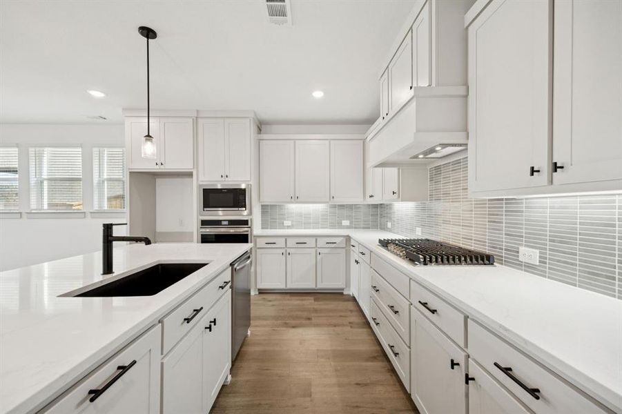 With a neutral color palette, stainless appliances and plenty of space, this beautiful kitchen will always be in style!