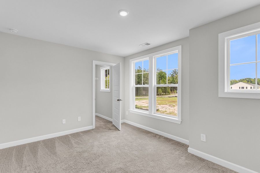 Spacious, unfurnished interior of a new home in Pineland Preserve, Summerville (Image 41).