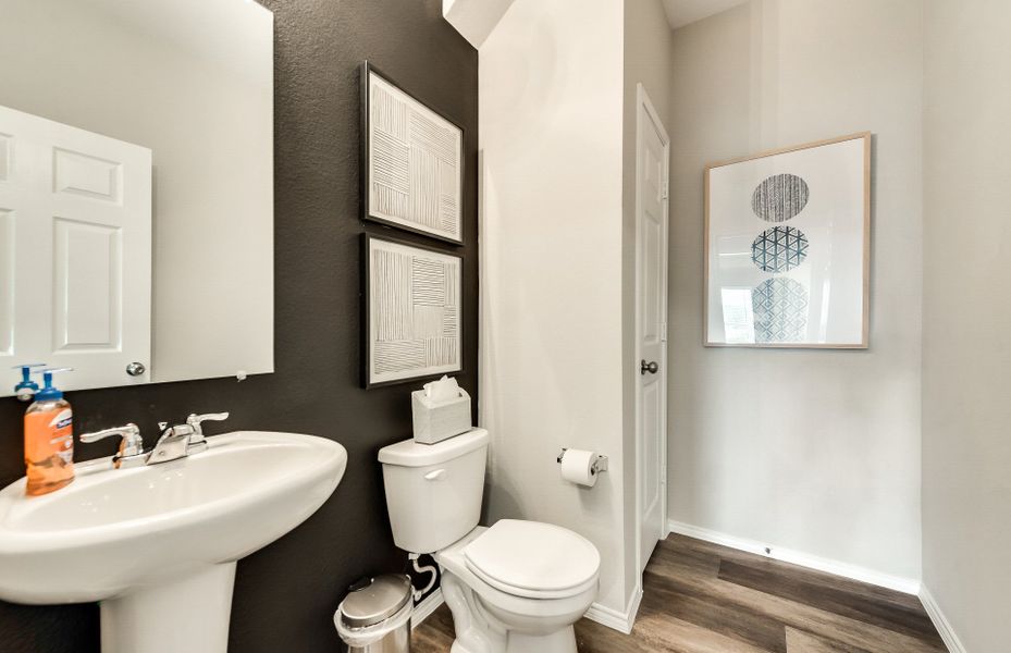 Powder bath off entryway with beautiful vanity