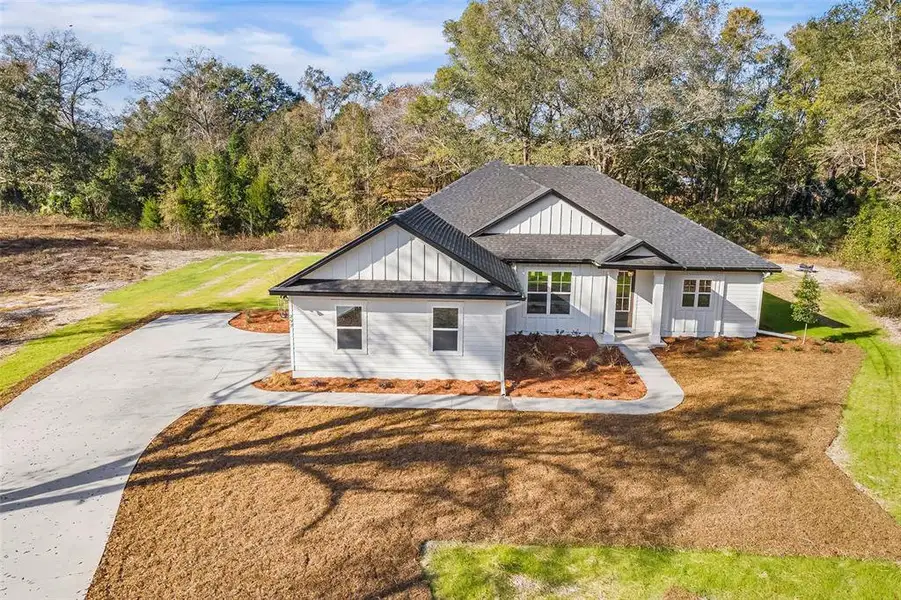 Front exterior of a new home in , Lake City, FL, highlighting curb appeal (Image 2). Front exterior of a new home in , Lake City, FL, highlighting curb appeal (Image 2).