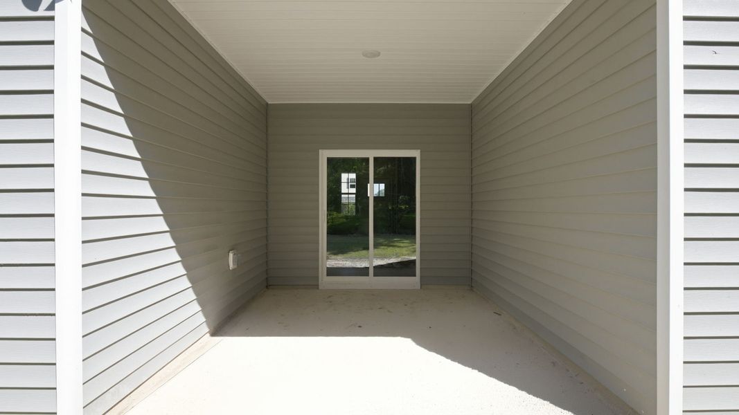 Exterior details and patio area of a home in Tyler - Home on the Lake, New Bern (Image 25).