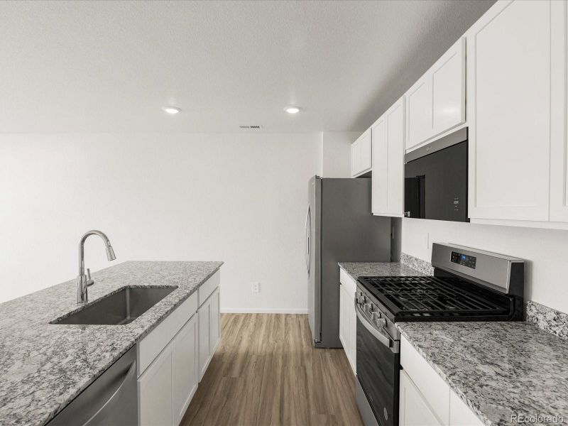 Furnished interior view inside a new home in Skyview at High Point, Aurora (Image 16).