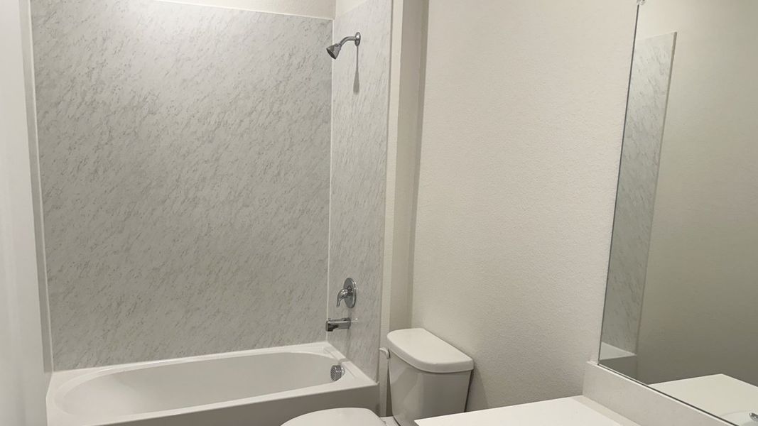 Representative furnished interior of a home built from the MIDLAND by D.R. Horton in Northspur, Forney (Image 8).