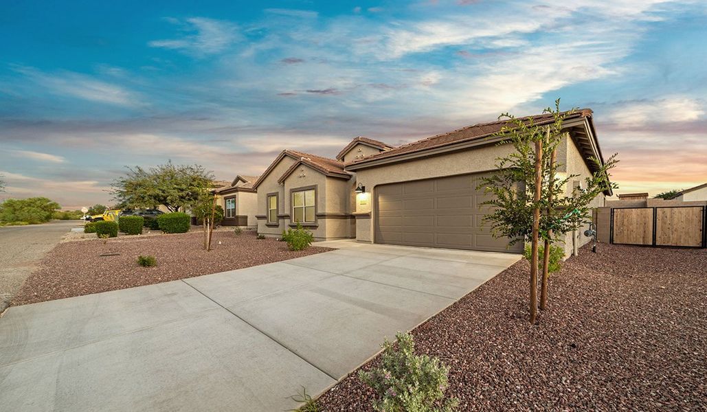 Front exterior of a new home in Sycamore Vista, Vail, AZ, highlighting curb appeal (Image 23). Front exterior of a new home in Sycamore Vista, Vail, AZ, highlighting curb appeal (Image 23).