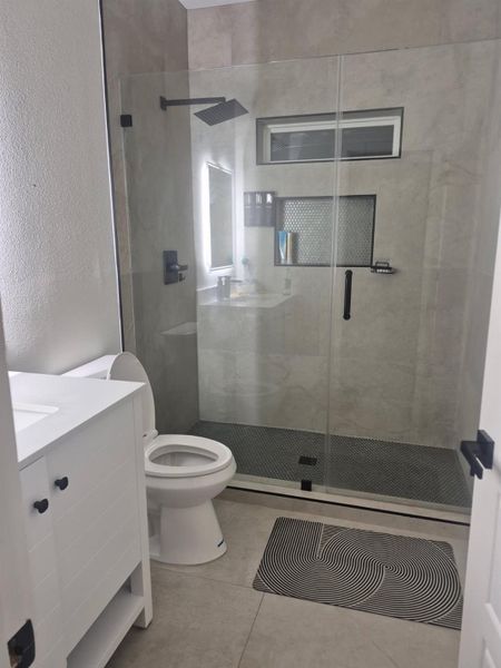 Modern bathroom with many upgrades.