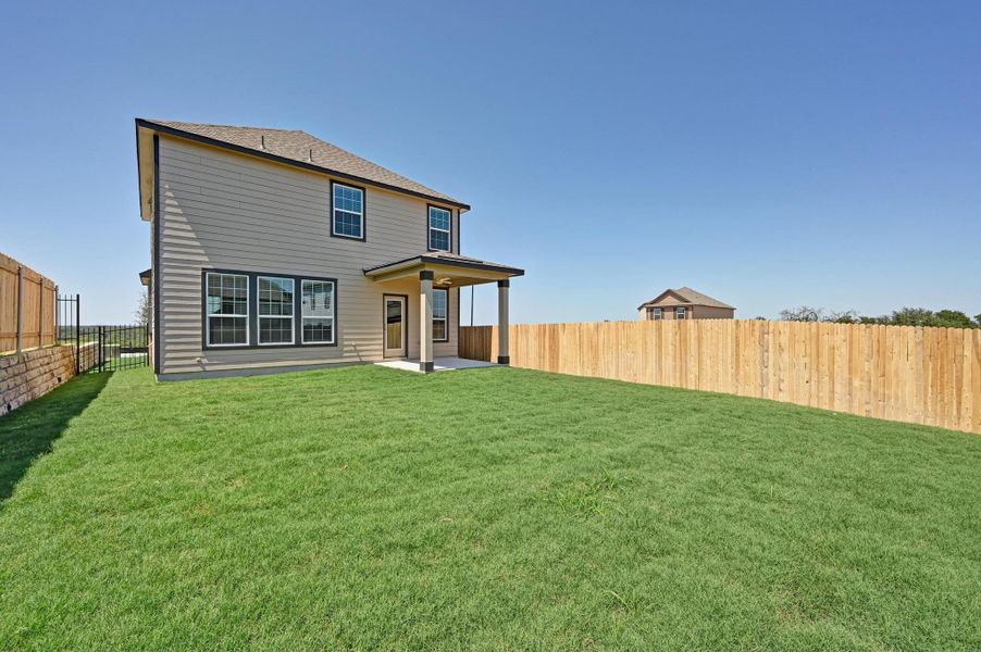 Exterior details and patio area of a home in Creekside at Estancia, Austin (Image 20).