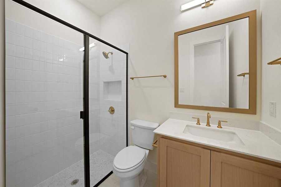 Full bath with a stall shower and vanity Full bath with a stall shower and vanity