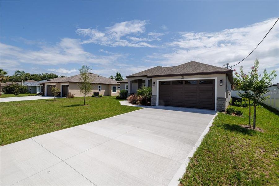 Front exterior of a new home in , Palm Coast, FL, highlighting curb appeal (Image 20).