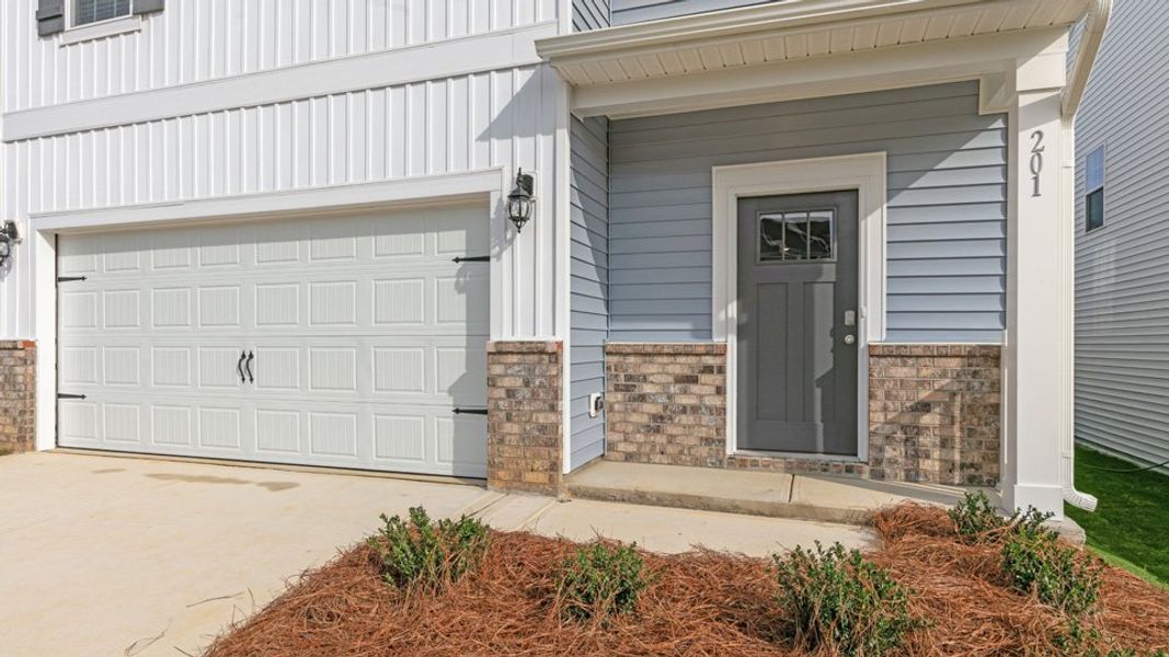 Exterior details and patio area of a home in The Grove at Matthews Landing, Fuquay Varina (Image 3). Exterior details and patio area of a home in The Grove at Matthews Landing, Fuquay Varina (Image 3).