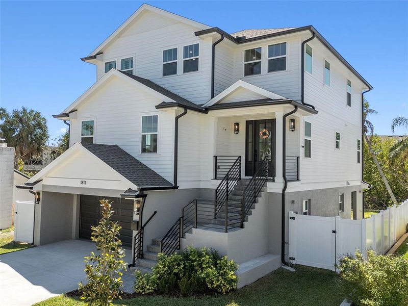 Front exterior of a new home in , St. Petersburg, FL, highlighting curb appeal (Image 2). Front exterior of a new home in , St. Petersburg, FL, highlighting curb appeal (Image 2).