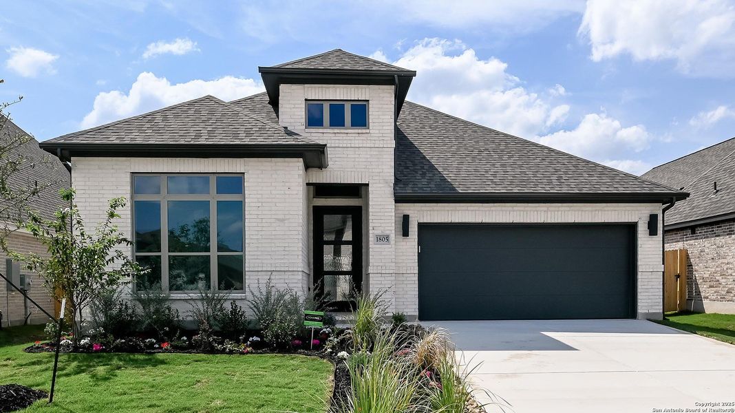 Front exterior of a new home in Meadows Of Mill Creek 50', Seguin, TX, highlighting curb appeal (Image 16).