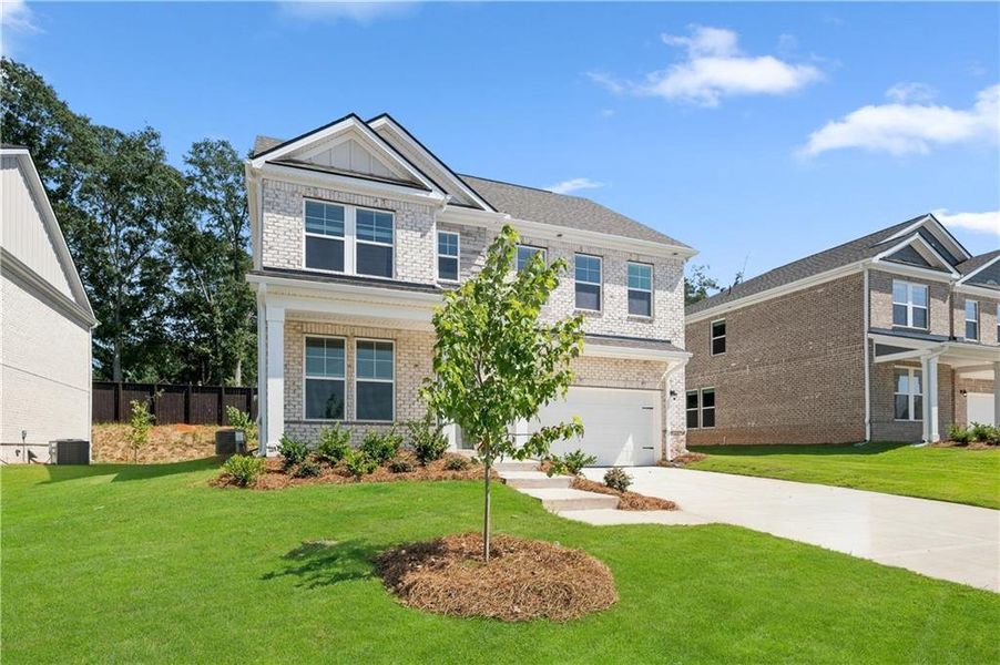 Front exterior of a new home in Bowers Farm, McDonough, GA, highlighting curb appeal (Image 17).