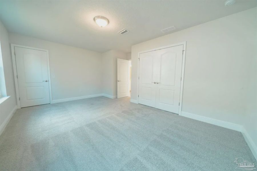 Representative unfurnished interior of a home built from the Plan 1645 by Adams Homes in Westpointe Place, Pensacola (Image 11).