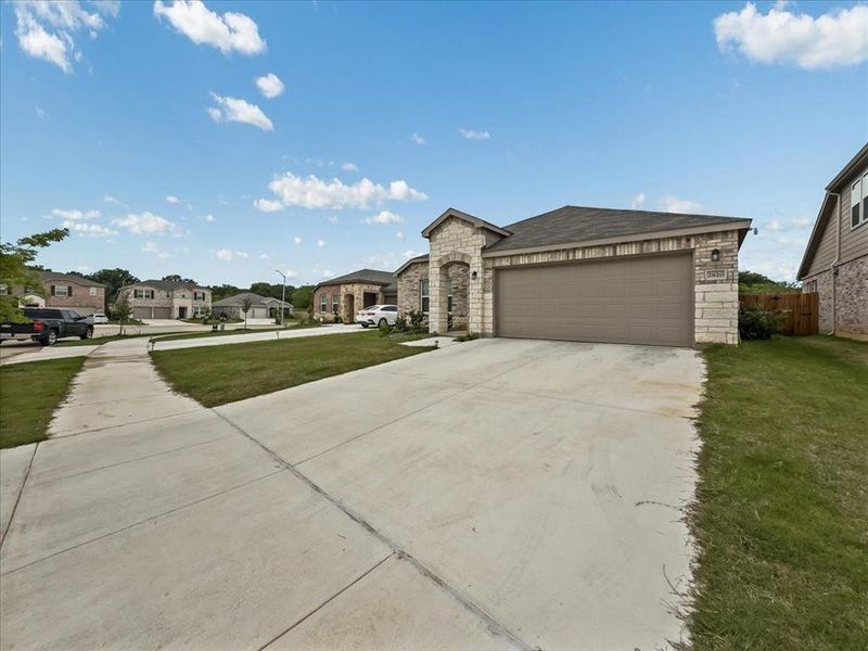 Front exterior of a new home in Townsend Green, Denton, TX, highlighting curb appeal (Image 23).
