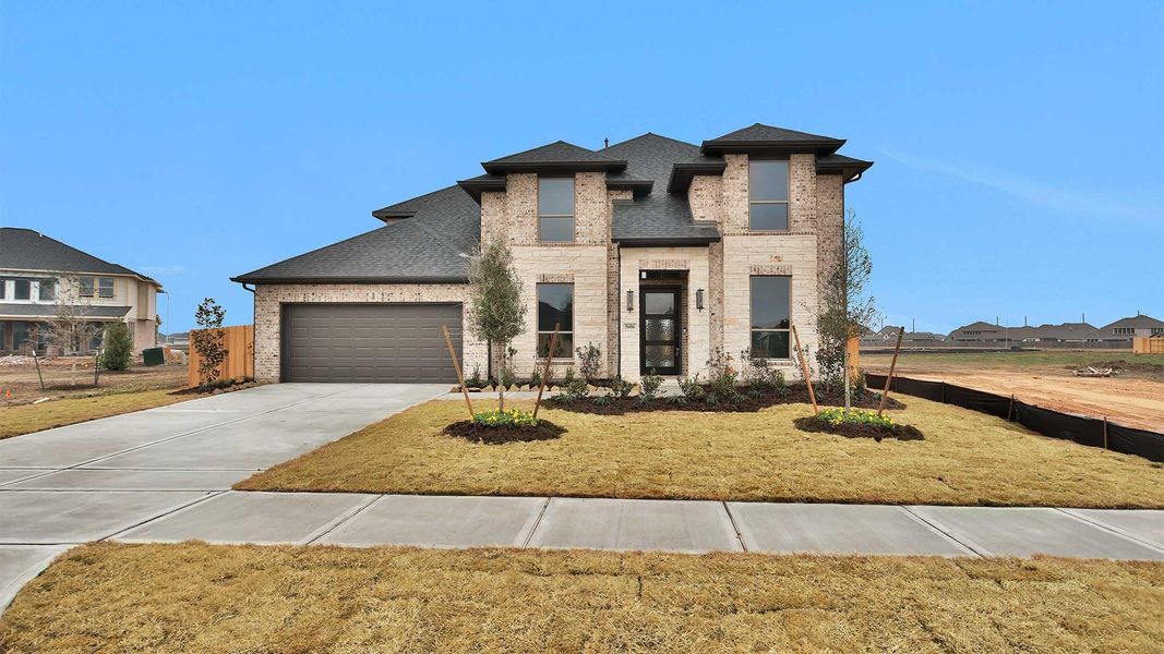 Front exterior of a new home in StoneCreek Estates, Richmond, TX, highlighting curb appeal (Image 2).
