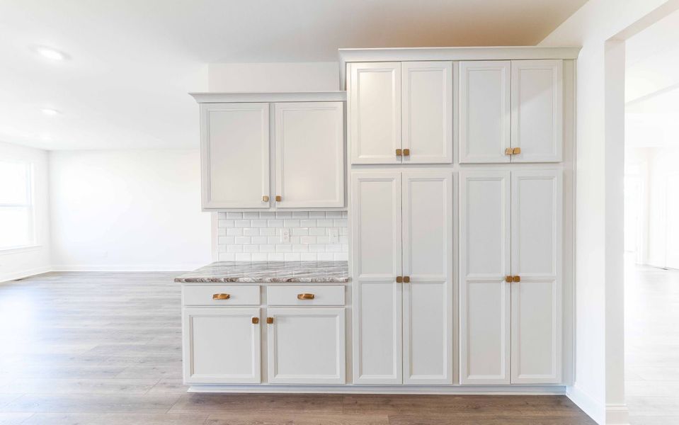 Furnished interior view inside a new home in Aden Woods, Fairview (Image 9).