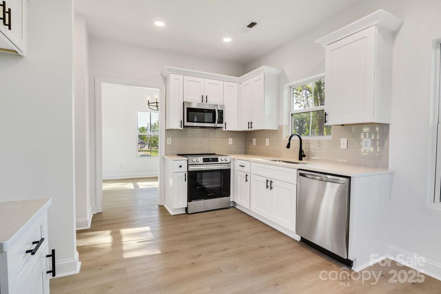 Furnished interior view inside a new home in , Statesville (Image 7).