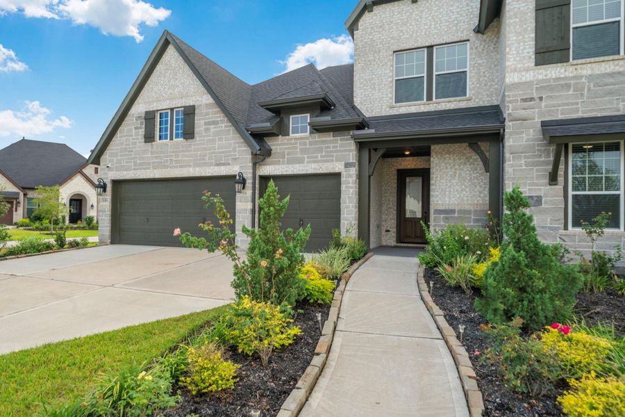 Front exterior of a new home in , Missouri City, TX, highlighting curb appeal (Image 26). Front exterior of a new home in , Missouri City, TX, highlighting curb appeal (Image 26).