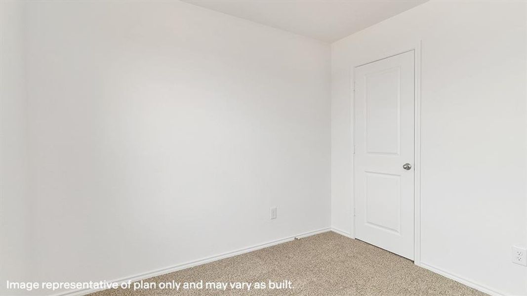 Spare room with carpet and baseboards